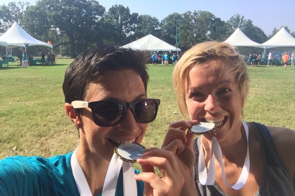 Two females bit their medals at an NOCC event