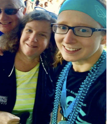 a young ovarian cancer patient in teal beads and headband