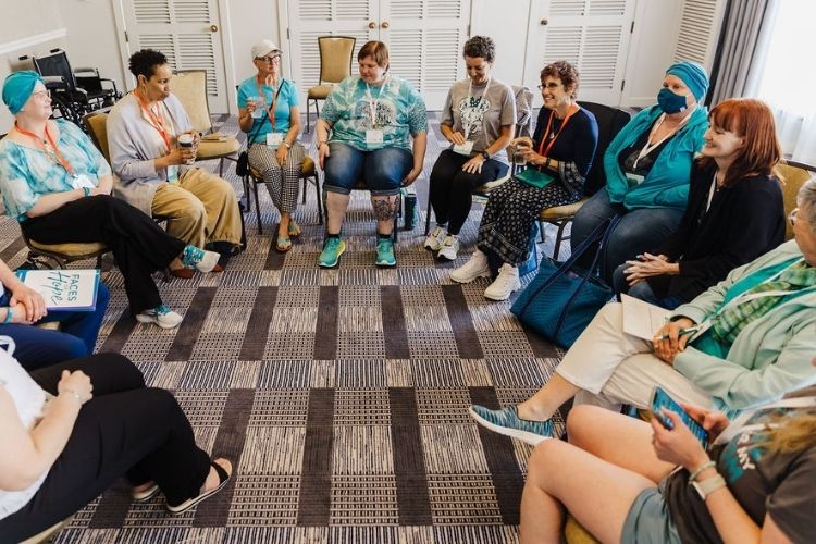 a group of ovarian cancer survivors sitting in a support group meeting